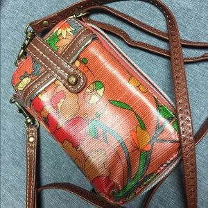 The Sak cell phone wallet, fits iPhone 6/7/8